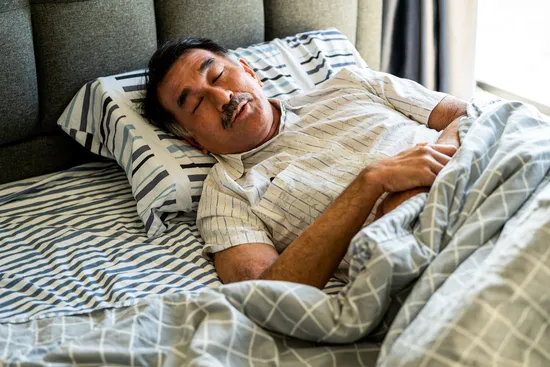 photo of Senior man sleeping