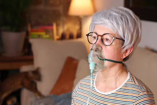 photo of senior women getting oxygen therapy